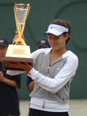Ana Ivanovic (SCG) shows her trophy during the award ceremony.