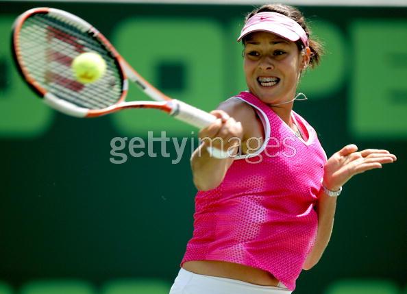 Ana Ivanovic of Serbia returns to Amelie Mauresmo of France during the NASDAQ-100 Open at the Crandon Park Tennis Center on March 30, 2005 in Key Biscayne, Florida.