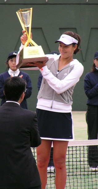 Ana Ivanovic (SCG) shows her trophy during the award ceremony.