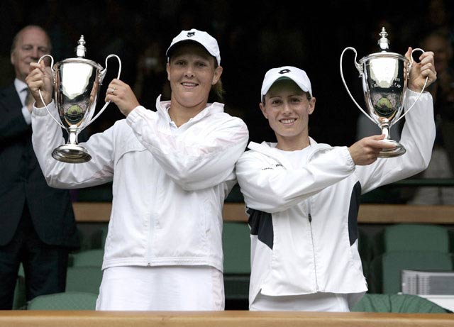 Cara Black and Liezel Huber presents her trophy after winning the doubles title of 119th Wimbledon Tennis Championships in London , Jule 3, 2005