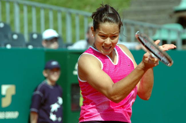 Ana Ivanovic returns the ball to Nathalie Dechy from France during their quarter final match, 29 April 2005 in Warsaw