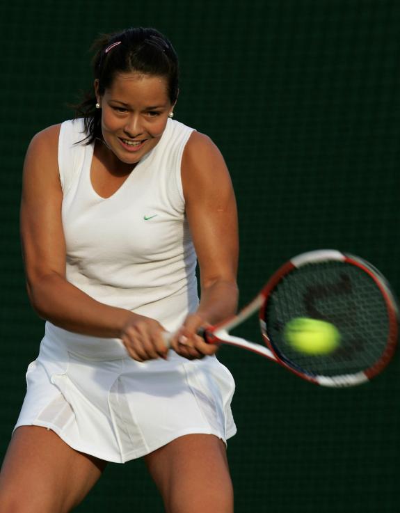 Ana Ivanovic  returns a ball  during  her first round match against Vera Douchevina from Russia, which she won  6-4 6-3.