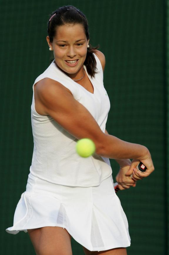 Ana Ivanovic  returns a ball  during  her first round match against Vera Douchevina from Russia, which she won  6-4 6-3.