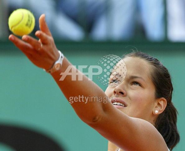 Ana Ivanovic of Serbia eyes the ball before serving to Francesca Schiavone of Italy during their fourth round match of the tennis French Open at Roland Garros, 30 May 2005 in Paris. Ivanovic won 6-4, 6-7(3), 6-3