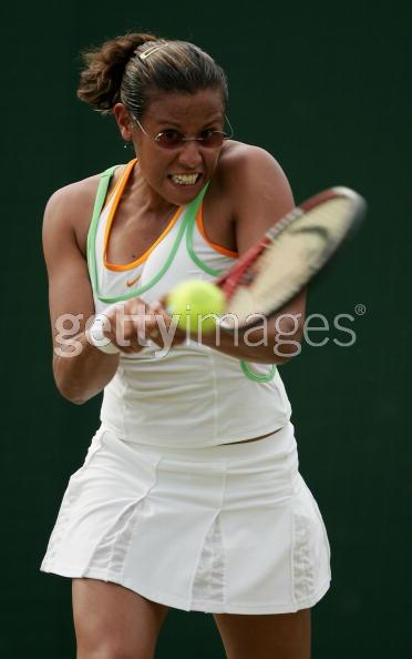 Stephanie Foretz of France in action against Ana Ivanovic of Serbia & Montenegro during the fourth day of the Wimbledon Lawn Tennis Championship on June 23, 2005 at the All England Lawn Tennis and Croquet Club in London.