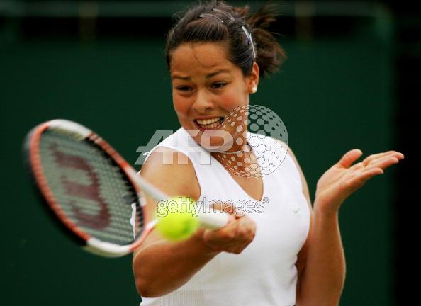 Ana Ivanovic of Serbia & Montenegro in action against Mary Pierce of France during the sixth day of the Wimbledon Lawn Tennis Championship on June 25, 2005 at the All England Lawn Tennis and Croquet Club in London