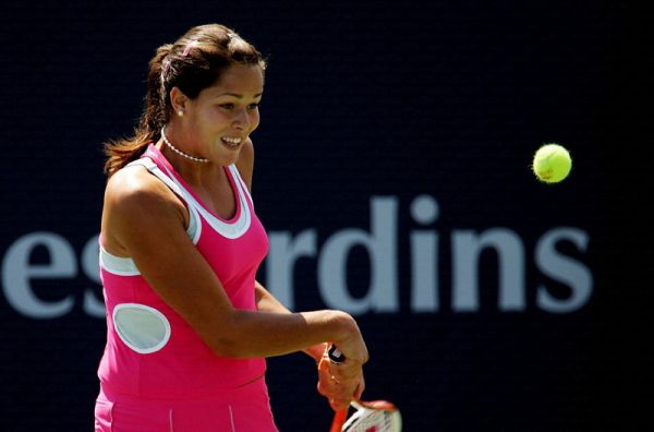 Ana Ivanovic of Serbia plays a backhand against Tathiana Garbin of Italy in the first round at the Sony Ericsson WTA Tour Rogers Cup tennis tournament August 16, 2005 at the Rexall Centre in Toronto, Canada