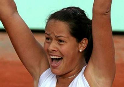 Ana Ivanovic of Serbia & Montenegro celebrates defeating Amelie Mouresmo of France in the third round match during the sixth day of the French Open at Roland Garros on May 28, 2005 in Paris, France. 