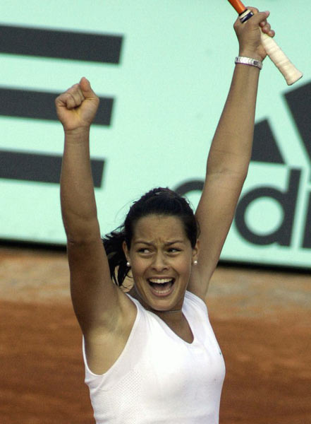 Ana Ivanovic of Serbia & Montenegro celebrates defeating Amelie Mouresmo of France in the third round match during the sixth day of the French Open at Roland Garros on May 28, 2005 in Paris, France. 