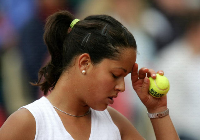 Serbia and Montenegros Ana Ivanovic, the number 29 seed, reacts during her match against Italys Francesca Schiavone, the number 22 seed, in the French Open tennis tournament at the Roland Garros stadium May 30, 2005