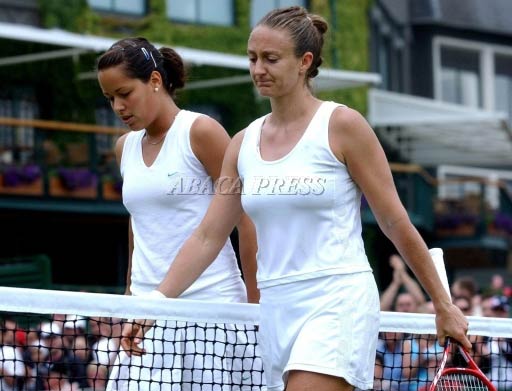 Ana Ivanovic  and Mary Pierce  leave the court after the 3d round match