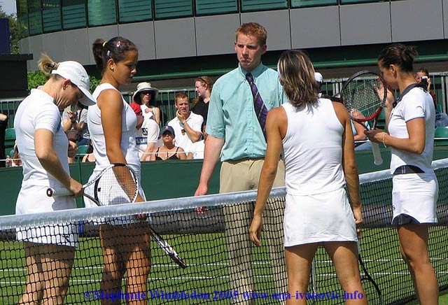 Ana Ivanovic  and  Tina Krizan in the beginning of first round match in doubles against Flavia Pennetta and Francesca Schiavone   from Italy on June 22, 2005 at the All England Lawn Tennis and Croquet Club in London.