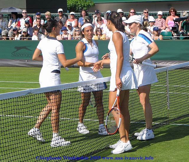 Ana Ivanovic  and  Tina Krizan after end of the first round match in doubles against Flavia Pennetta and Francesca Schiavone   from Italy on June 22, 2005 at the All England Lawn Tennis and Croquet Club in London.