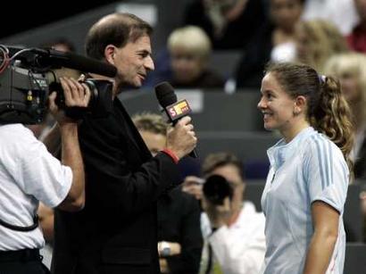 Patty Schnyder (R) of Switzerland is interviewed by former tennis player Heinz Guenthardt (L) after winning the semi-final match against Ana Ivanovic of Serbia at the Zurich Open WTA tennis tournament in Zurich October 22, 2005