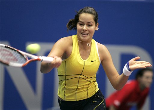 Ana Ivanovic  returns the ball to Tamira Paszek of Austria during their Linz Open second round tennis match in Linz October 27, 2005. Ivanovic won 7-5 6-1.