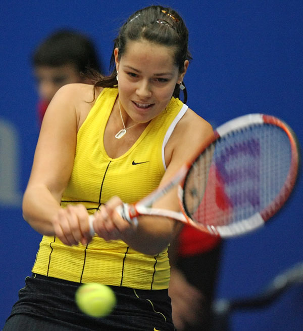 Ana Ivanovic  returns a backhand  to Tamira Paszek of Austria during their Linz Open second round tennis match in Linz October 27, 2005. Ivanovic won 7-5 6-1.