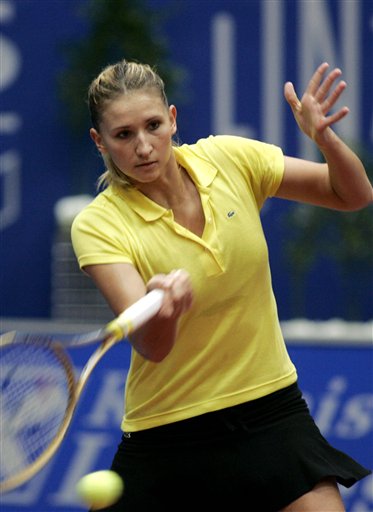 Tatiana Golovin from France returns the ball to Ana ivanovic in their quarterfinal match at the WTA Ladies tennis tournament in Linz on Friday, Oct. 28, 2005. Ivanovic won 7-5, 6-3. 