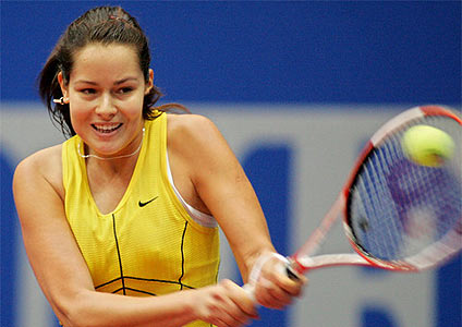 Ana Ivanovic returns the ball to Shinobu Asagoe from Japan in their first round match at the WTA tennis tournament in Linz. Ana win 7:6 (4) 6:2.