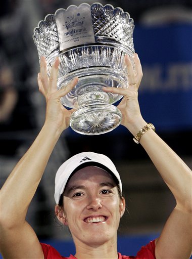 Justine Henin-Hardenne of Belgium holds up the winner's trophy after beating Francesca Schiavone of Italy in the final at the Sydney International tennis tournament in Sydney, Australia, Friday, Jan. 13, 2006. Henin-Hardenne won the match 4-6, 7-5, 7-5. 