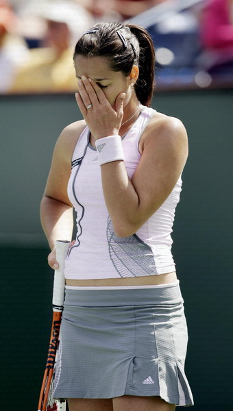 Ana Ivanovic of Serbia Montenegro puts her hand to her face after missing a shot in her match against Elena Dementieva of Russia at the Pacific Life Open tennis tournament in Indian Wells, California March 16, 2006