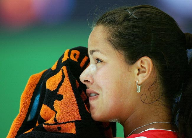 Ana Ivanovic of Serbia and Montenegro wipes her face with a towel in a break between games in her second round match against Samantha Stosur of Australia during day four of the Australian Open at Melbourne Park January 19, 2006 in Melbourne, Australia.