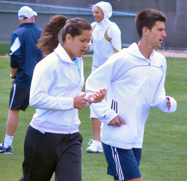 Novak Djokovic and Ana Ivanovic jog and stretch before practicing