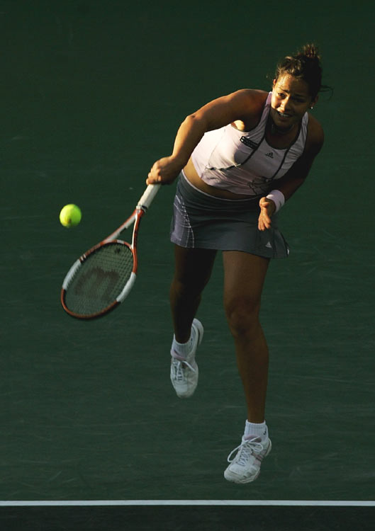 Ana Ivanovic of Serbia and Montenegro returns the ball to Amelie Mauresmo of France at the Nasdaq- 100 Open tennis tournament in Key Biscayne, Fla. Monday, March 27, 2006