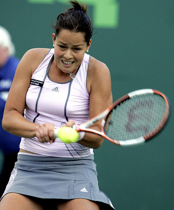 Ana Ivanovic of Serbia and Montenegro returns the ball to Amelie Mauresmo of France at the Nasdaq- 100 Open tennis tournament in Key Biscayne, Fla. Monday, March 27, 2006