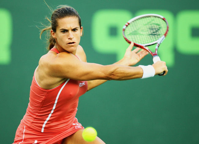 Amelie Mauresmo of France returns the ball to Ana Ivanovic of Serbia and Montenegro at the Nasdaq- 100 Open tennis tournament in Key Biscayne, Fla. Monday, March 27, 2006