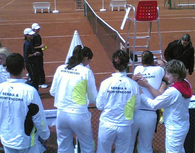 Serbian team congratulating Timotic 