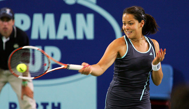 Ana Ivanovic of Serbia and Montenegro plays a forehand shot in her mixed doubles match against Lisa Raymond and Taylor Dent from the U.S. during the Hopman Cup in Perth, Australia January 1, 2006. The U.S. team won the match 7-6 6-2. 