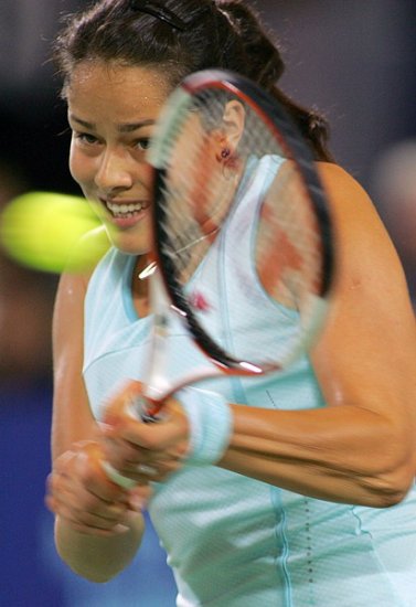 Ana Ivanovic of Serbia and Montenegro plays a backhand shot during her women's singles tennis match against Svetlana Kuznetsova of Russia at the Hopman Cup in Perth, Australia January 5, 2006. Kuznetsova won the match 6-1 6-4. 