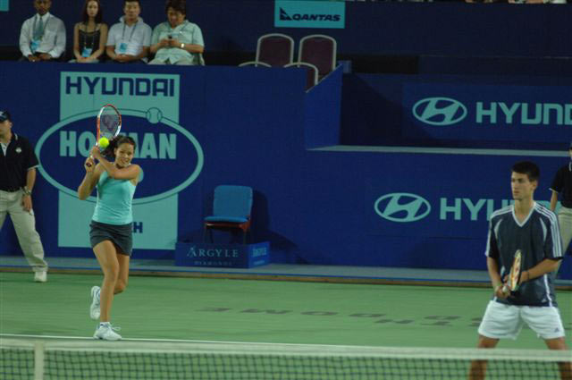 Ana Ivanovic (L) of Serbia and Montenegro and Novak Djokovic during their mixed doubles match against Svetlana Kuznetsova and Yuri Schukin of Russia during the Hopman Cup in Perth, Australia January 5, 2006. Serbia and Montenegro the match 6-2 7-6.