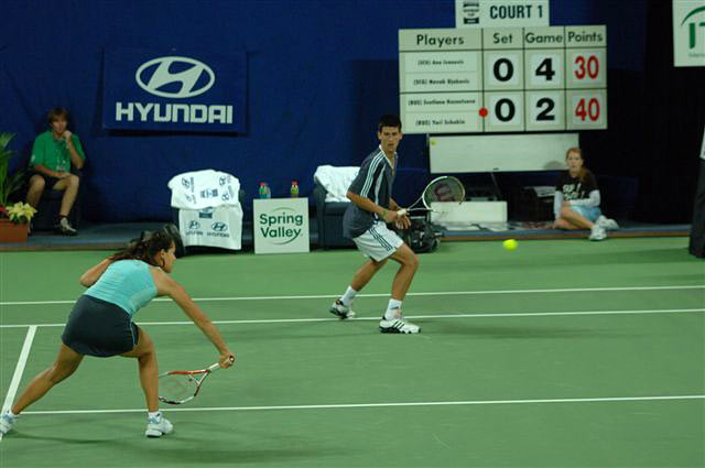 Ana Ivanovic (L) of Serbia and Montenegro and Novak Djokovic during their mixed doubles match against Svetlana Kuznetsova and Yuri Schukin of Russia during the Hopman Cup in Perth, Australia January 5, 2006. Serbia and Montenegro the match 6-2 7-6.