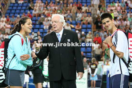 Ana Ivanovic (L) and Novak Djokovic of Serbia and Montenegro before their mixed doubles match against Lisa Raymond and Taylor Dent from the U.S. at the Hopman Cup in Perth, Australia January 1, 2006.