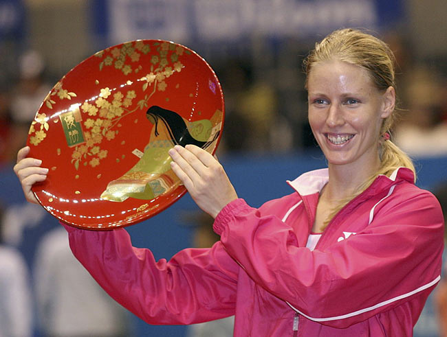 Elena Dementieva of Russia poses with winner's plate at the awarding ceremony of the Pan Pacific Open tennis tournament in Tokyo Sunday, Feb. 5, 2006. Dementieva defeated Martina Hingis of Switzerland 6-2, 6-0.