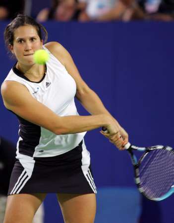 Sofia Arvidsson of Sweden plays a backhand in her mixed doubles match against Ana Ivanovic and Novak Djokovic of Serbia and Montenegro during the Hopman Cup in Perth, Australia January 2, 2006