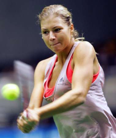 Russia's Maria Kirilenko returns a backhand to Ana Ivanovic of Serbia and Montenegro during their second round match at the Pan Pacific Open tennis tournament in Tokyo February 2, 2006. 